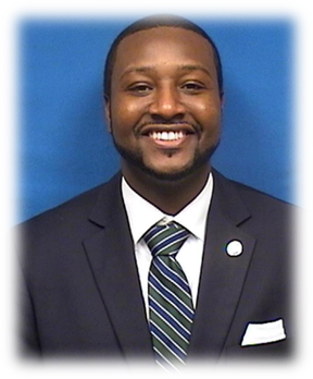 A person in a suit and tieDescription automatically generated with medium confidence